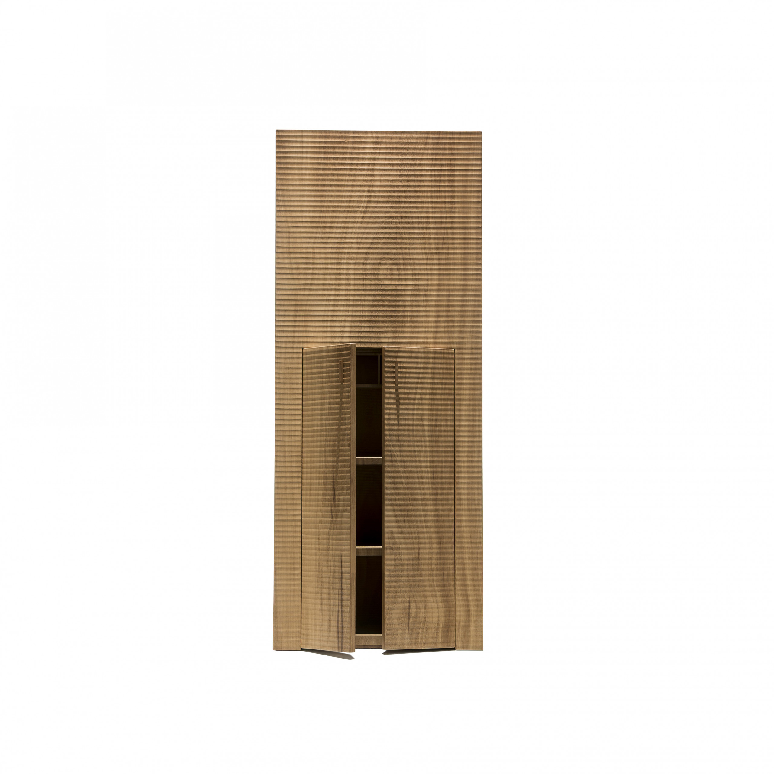 Petra Cabinet - <p>Petra is a two-door cabinet made as a single block using wood with vertical grain. It is manually finished on all sides using a plane. The hinges are concealed. The entire manufacturing and finishing process is carried out manually in our workshop. The wood used for this item is Sipo mahogany. In this cabinet the need to achieve greater lightness led us to taper the shape as it rises, resulting in these forms which are striking and meaningful albeit functional as containers and custodians.<br />
The architectural function always goes beyond the immediate practical use.</p>
 | Matter of Stuff